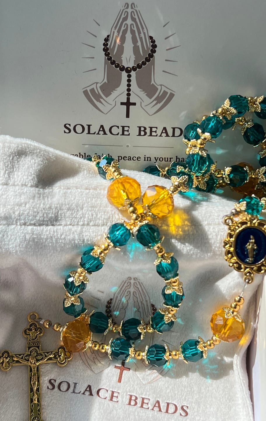 Customer photo review of SolaceBeads Peacock Blue & Champagne Crystal Rosary: A Prismatic Glow of Sacred Light