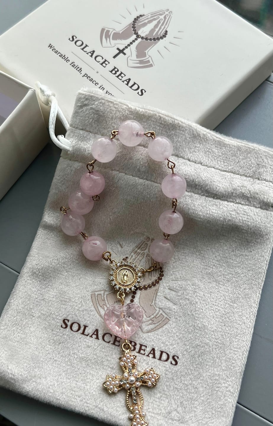 Customer photo review of SolaceBeads Artisan Rose Quartz Pocket Rosary: Soft Pink Beads with Sacred Cross & Marian Accents