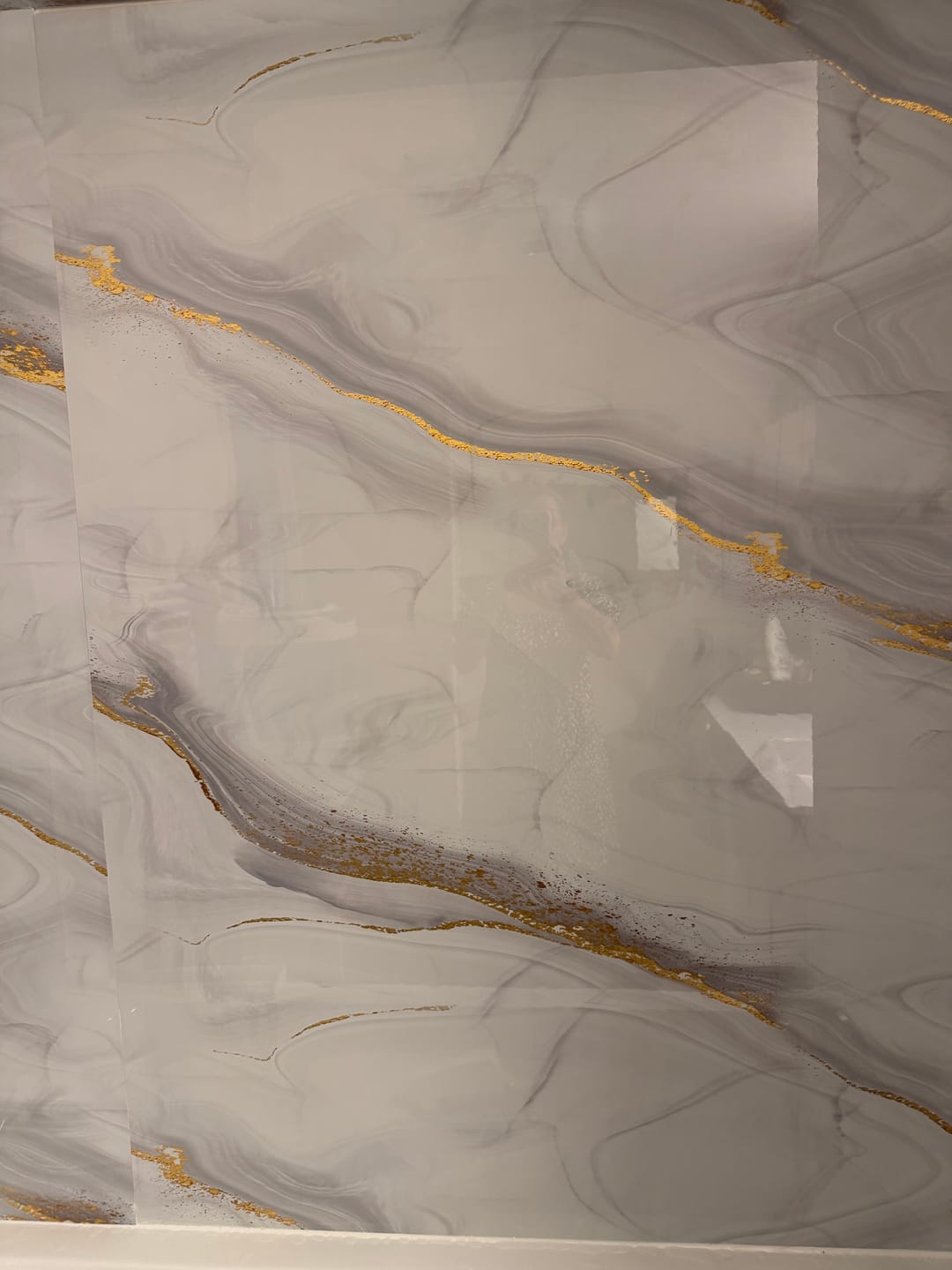 Customer photo review of Panneau Mural PVC Effet Marbre Doré – Étanche et facile à poser