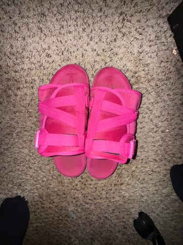 Customer's bright pink Mystery DracoSlides shown on a carpet.