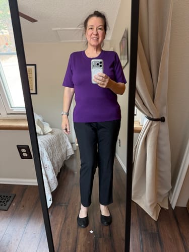 Reviewer's full-length mirror selfie showing the fit of the Anna Crew Sweater in Plum Crush with black pants.