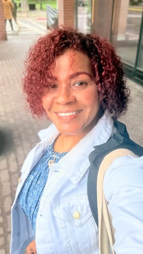 Reviewer smiling, showing the appearance of her skin after using the Korean Silk Collagen Ampoule.