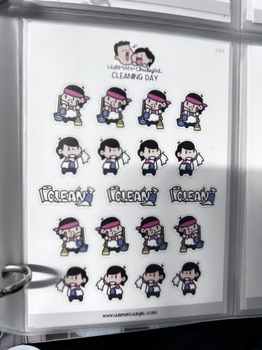 Customer's sheet of cute Cleaning Day Planner Stickers organized in a clear binder sleeve.