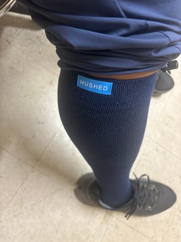 Customer wearing the navy Eucalyptus Lyocell Compression Socks on their lower leg.