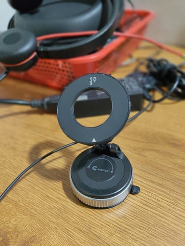 Reviewer's Casence MagPro Magnetic Phone Holder on a wooden table, showing its ring and suction base.