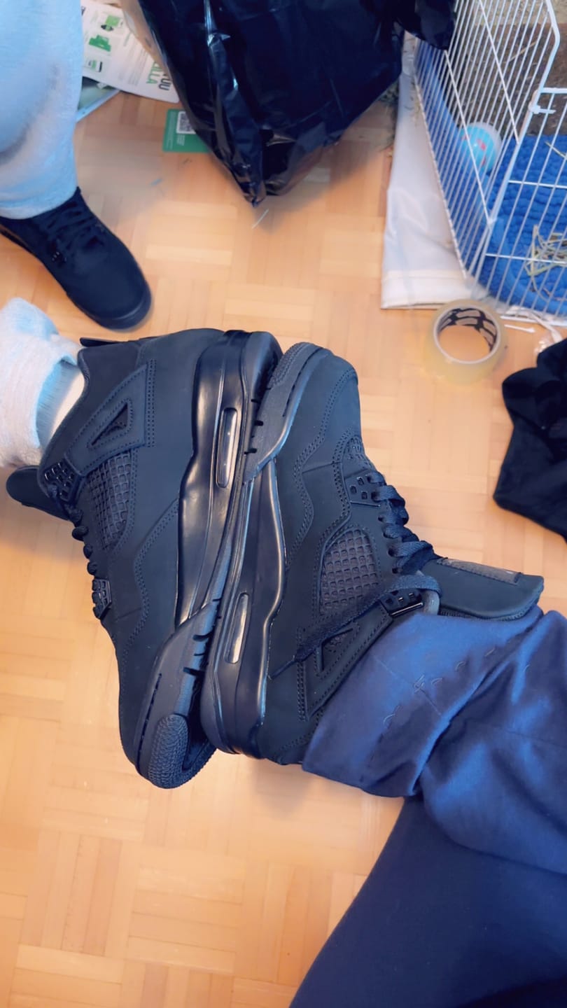 Customer photo review of Air Jordan 4 Retro Black Cat (2025)