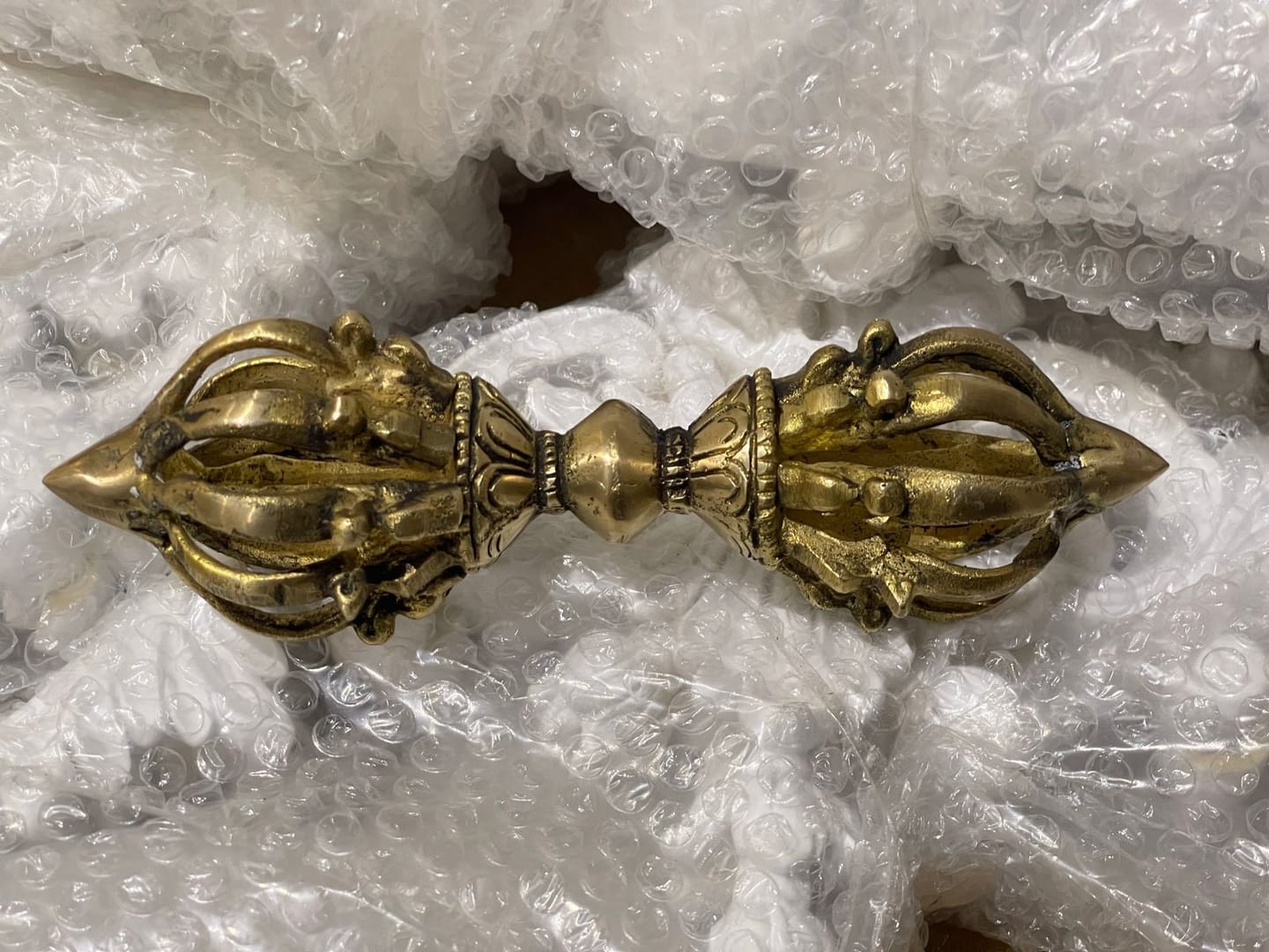 Customer photo review of Brass Vajra Dorje Ritual Tool Vastu Remedy for Protection, Tibetan Meditation and Home Temple Energy 15.7 x 4 cm | 340 gm