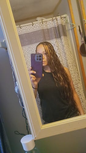 Reviewer in a mirror selfie showing long, wavy Body Wave Human Crochet Hair with a #4/27/30 mix color blend.