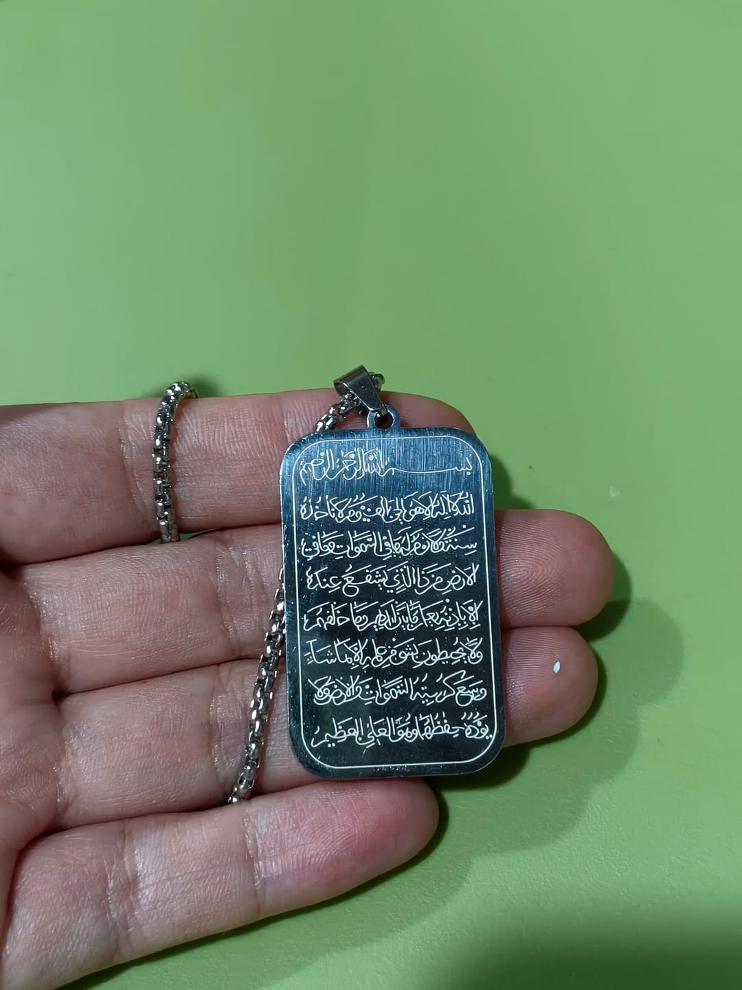 Customer photo review of HilalHaven Tablet of Stillness Ayatul Kursi Engraved Dog Tag Necklace — Polished Stainless Steel