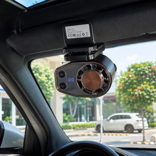 Cooling fan attached to a car sun visor