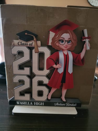 Customer's personalized 2-layered wooden plaque featuring a graduate illustration, 'Class of 2026', and 'Wasilla High'.