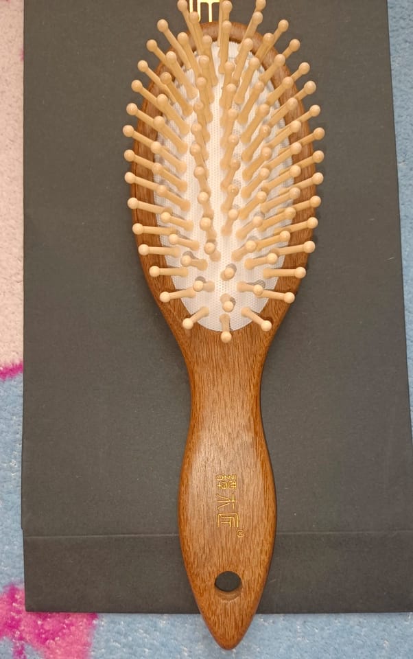 Customer photo review of Orange Cat Hair Brush