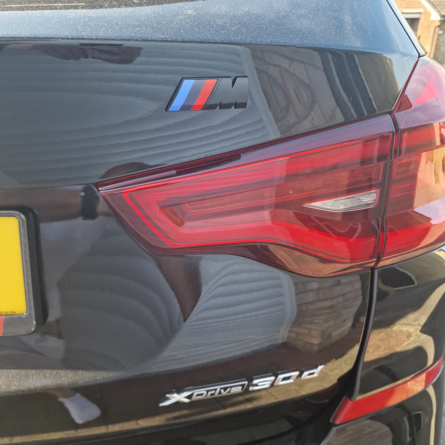 Customer photo review of GLOSS BLACK BMW M TRUNK BADGE