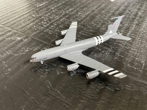 Customer's grey die-cast USAF KC-135R model, showing the black and white D-Day stripes on the wings and fuselage.