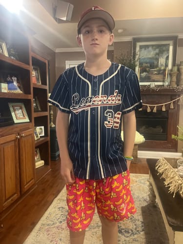 Customer wearing a custom navy pinstripe baseball jersey with 'Legends' and the number '34' on the front.