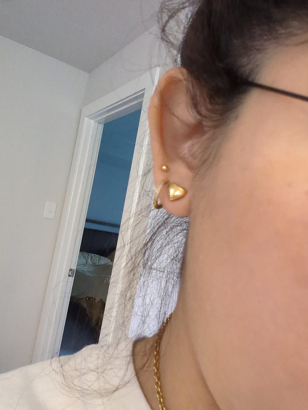 Customer photo review of 925 Sterling Silver Gold Tiny Ball Stud Earrings