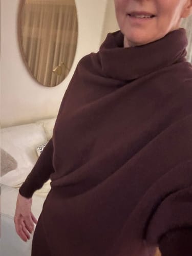 Reviewer wearing the Asymmetric Draped Roll Neck in Amethyst Plum, showing its soft and flowing drape.