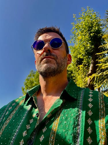 Customer photo review of Men's Retro Green Striped Print Button Up 70s Vintage Short Sleeve Shirt