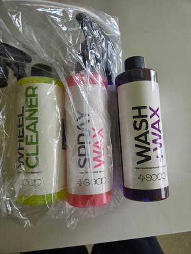 Customer's +Soap Wheel Cleaner, Spray Wax, and Wash + Wax bottles from the detail starter kit in plastic packaging.