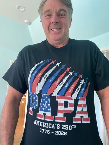 Reviewer wearing a personalized 'PAPA' shirt celebrating America's 250th anniversary with a flag design and custom names.