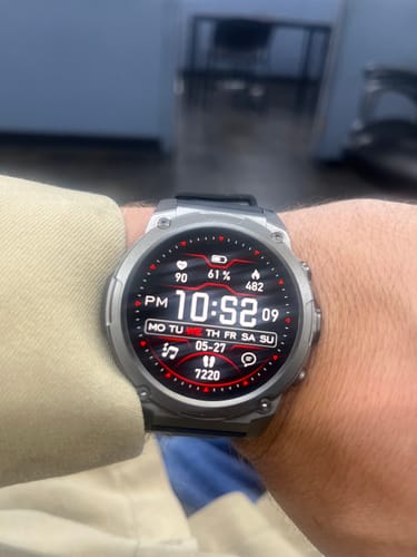 Close-up of a customer's Gard Pro Ultra 3 on their wrist. The screen shows a detailed digital face with health data.