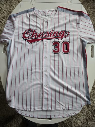 Customer's custom pinstripe baseball jersey. The front reads 'Chasing 30' in red and black lettering.