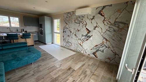 Customer photo review of Panneau Mural PVC Marbre Qatar – Veiné doré, Facile a Poser