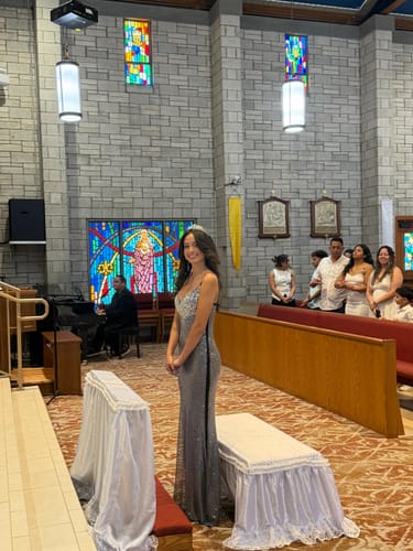 Reviewer standing in a church wearing the sparkly, form-fitting Maravelle Rhinestone Mermaid Maxi Dress.