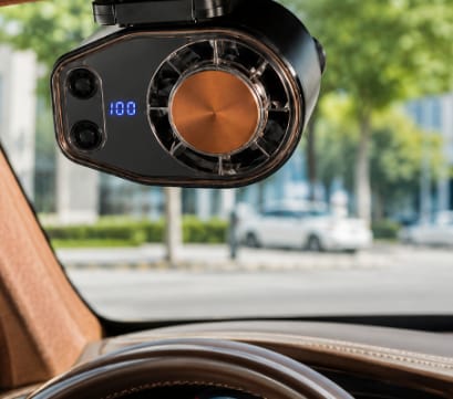 Cooling fan clipped onto a car sun visor