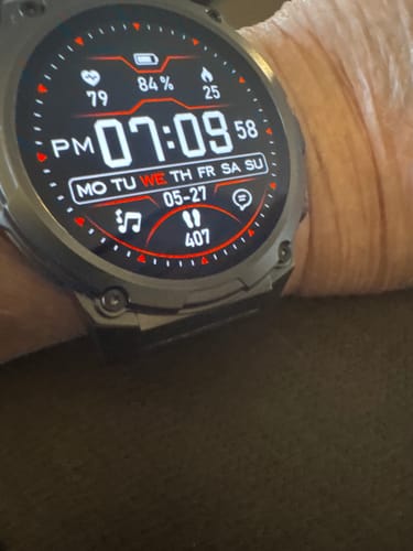 Close-up of a reviewer's Gard Pro Ultra 3 watch on their wrist, showing the detailed digital watch face.