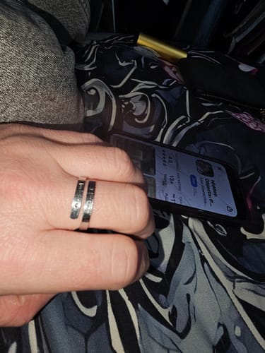 Close-up of a reviewer wearing the engraved silver I F♡cking Love You Ring on their finger.