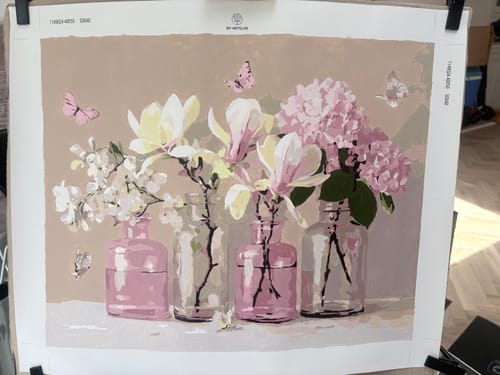 Customer's completed Fragile Paint by Number canvas showing pink flowers in jars with butterflies.