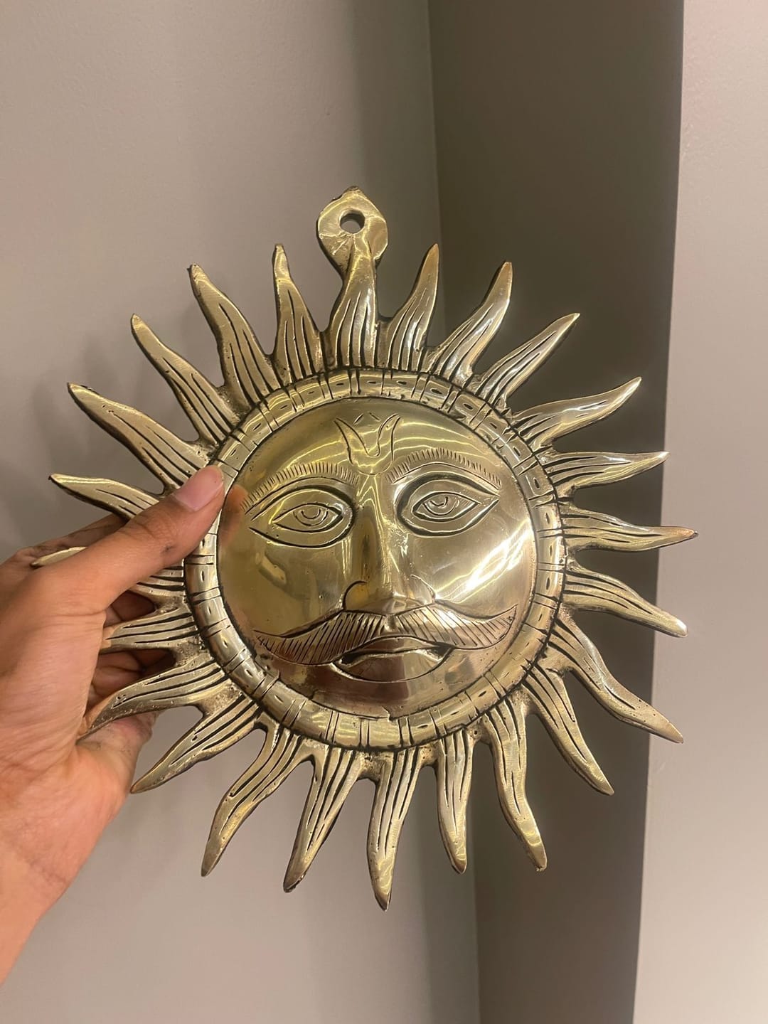 Customer photo review of Brass Surya (Sun) Ji Wall Hanging Idol Vastu Remedy for East Direction Balance, Fame and Positive Energy | 24 X 24 cm | 1 kg