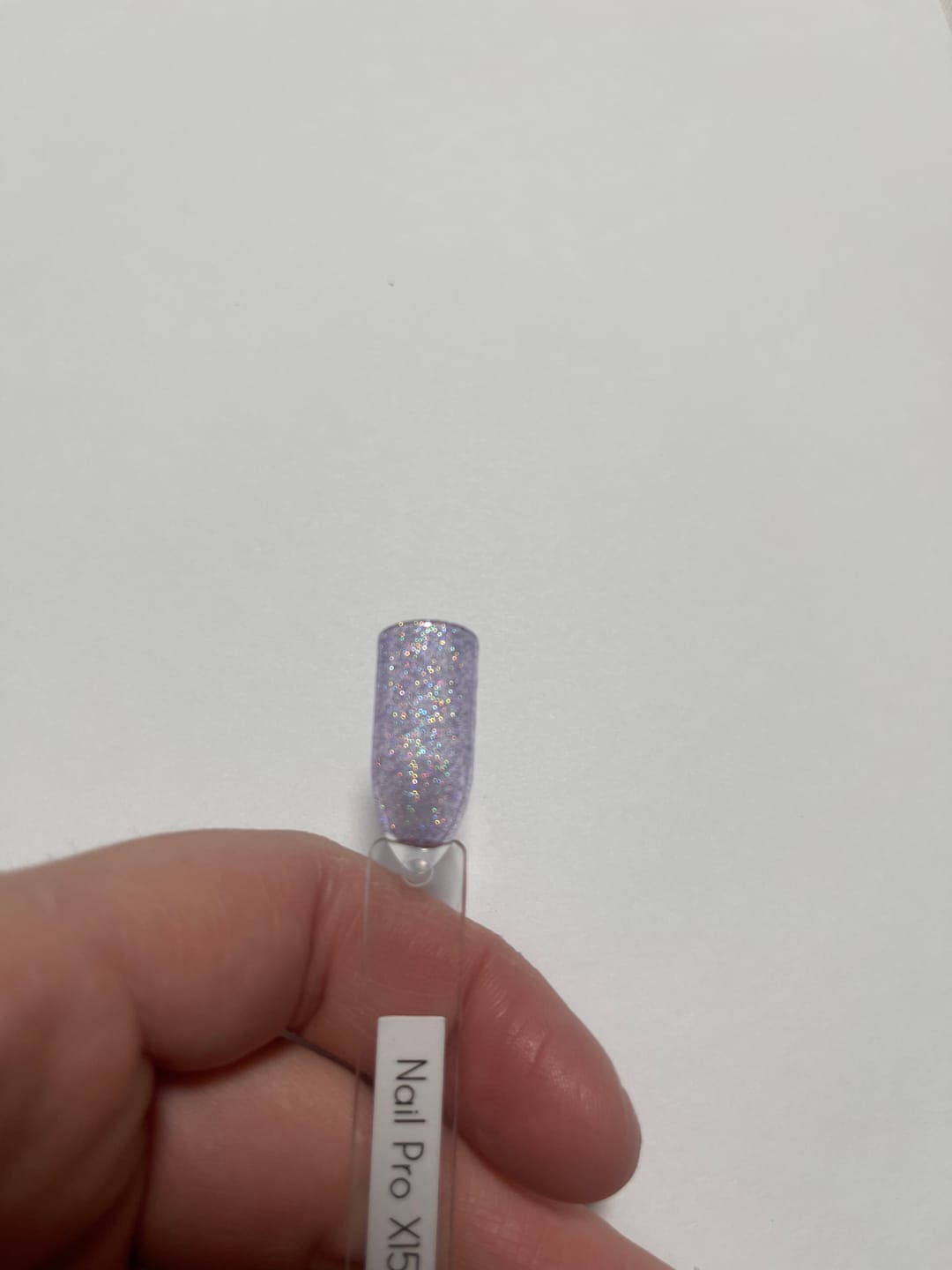 Customer photo review of NAIL PRO Esmalte Permanente 8 ml X157 Morado pastel con micro glitter