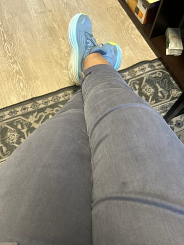 Close-up of a customer wearing the blue/gray Judy Blue Aurora weekender jeans with rolled cuffs.