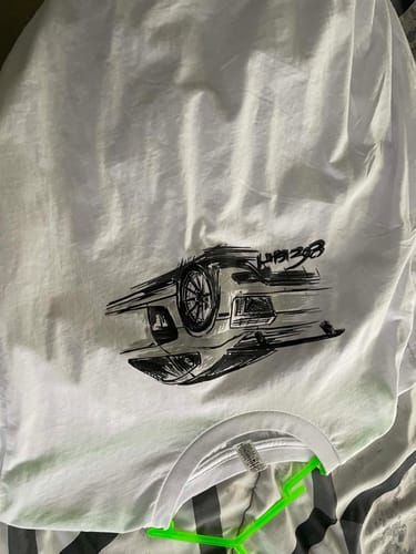 Reviewer's white 80Eighty Rendering Shirt laid flat, showing the black sketch-style car graphic.