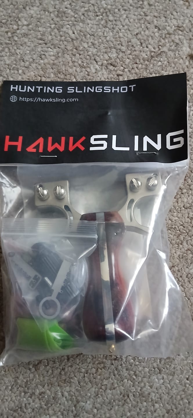 Customer photo review of Laser II - Compact Stainless Steel Wooden Handle Laser Shooting & Hunting Slingshot