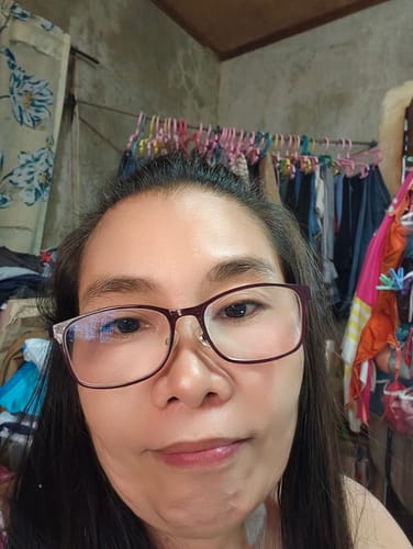 Reviewer's selfie showing her face with smooth-looking skin in a review for the Bad Skin™ Korean Collagen Bomb Hydrating Ampoule.