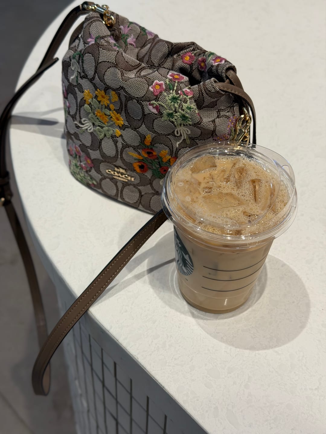 Customer photo review of Coach Women's Faye Mini Drawstring Bag In Signature Jacquard With Floral Embroidery Gold/Oak Multi