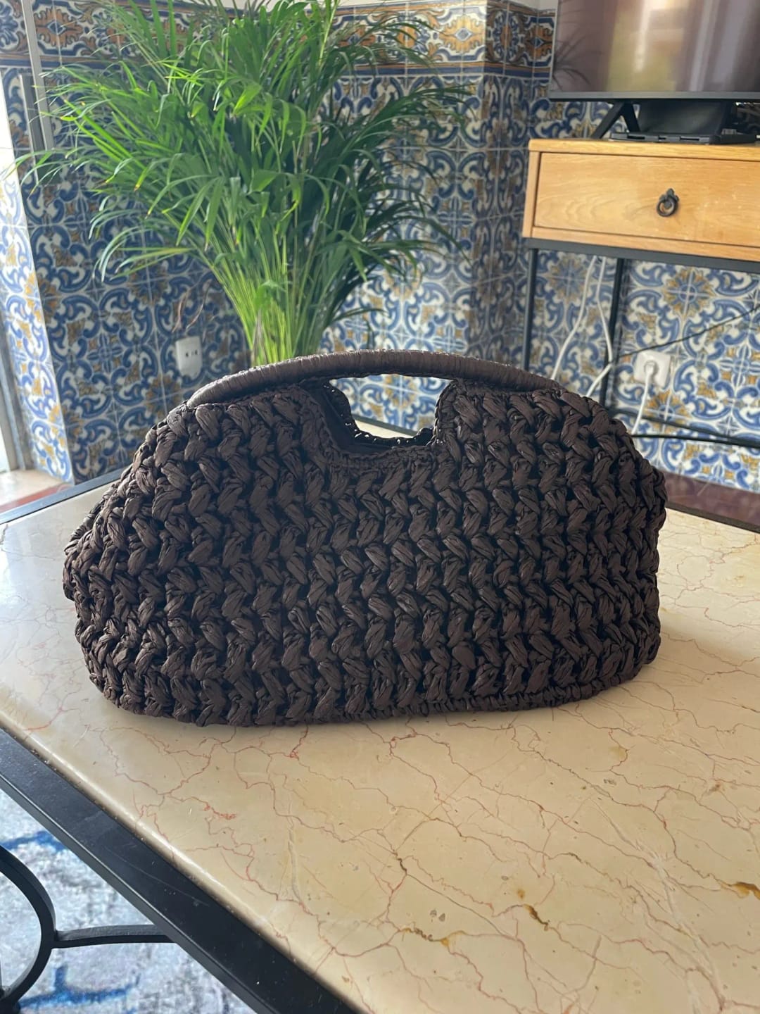 Customer photo review of Raye Woven Straw Shell Clutch