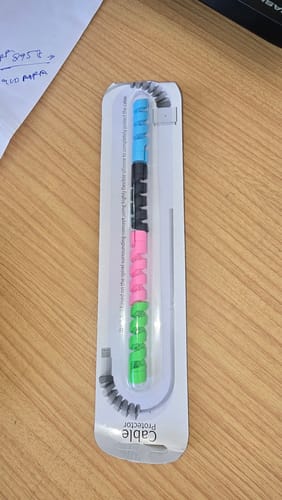 Customer's Cable Protector Set in its packaging, showing four colorful spiral grips on a cable.