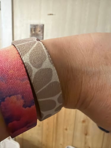 Customer wearing the beige, patterned Wonderfully Made Bible Verse Bracelet on their wrist.