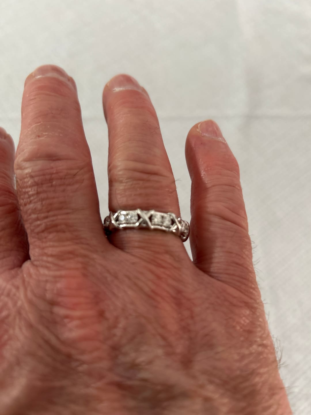 Customer photo review of MOISSANITE ETERNITY X RING.