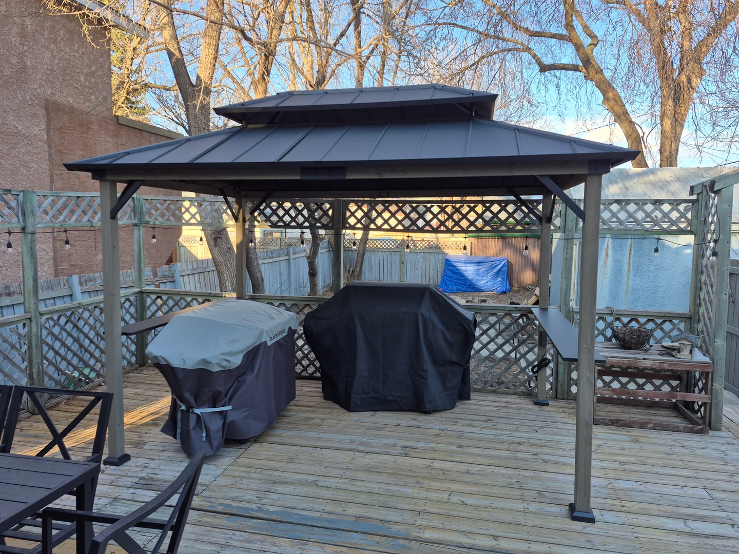Customer photo review of SUNJOY 8x12 Wood Frame Grill Gazebo with Electrical Outlets and Shelves - Black