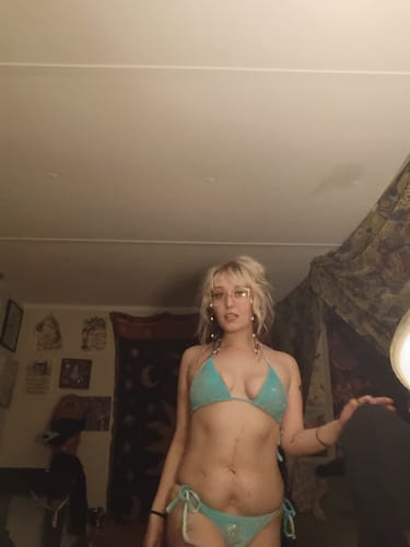 Reviewer posing indoors wearing the blue velvet rhinestone bikini set.