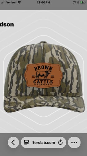 Customer's screenshot of their custom leather patch trucker hat in a green camo pattern.