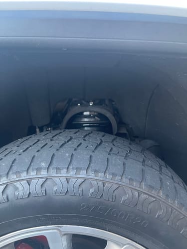 Close-up of the customer's 2" Front Leveling Lift Kit installed on a truck's front suspension.