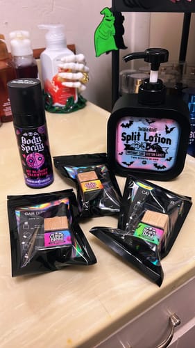 Customer's Split Lotion and other spooky-themed products displayed on a bathroom counter.