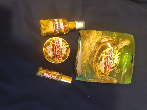 Reviewer's Dill Breaker Discovery Set, including body glaze, body drops, and a roll-on, displayed on a dark surface.