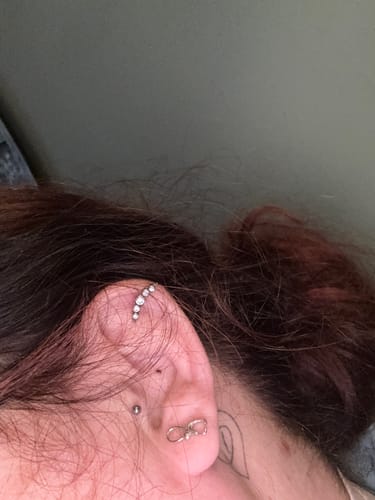 Customer showing the beautiful earrings they received in the Luxury Gift Box.
